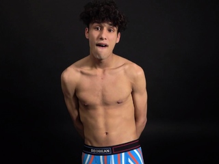 Curly twink boy shows off his slim body on webcam